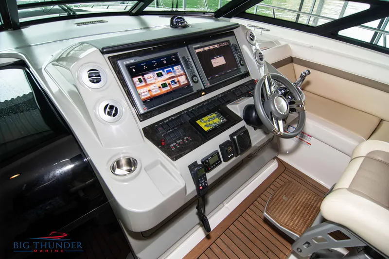  Yacht Photos Pics 2013 Sea Ray 540 Sundancer helm with advanced navigation systems and luxurious seating.