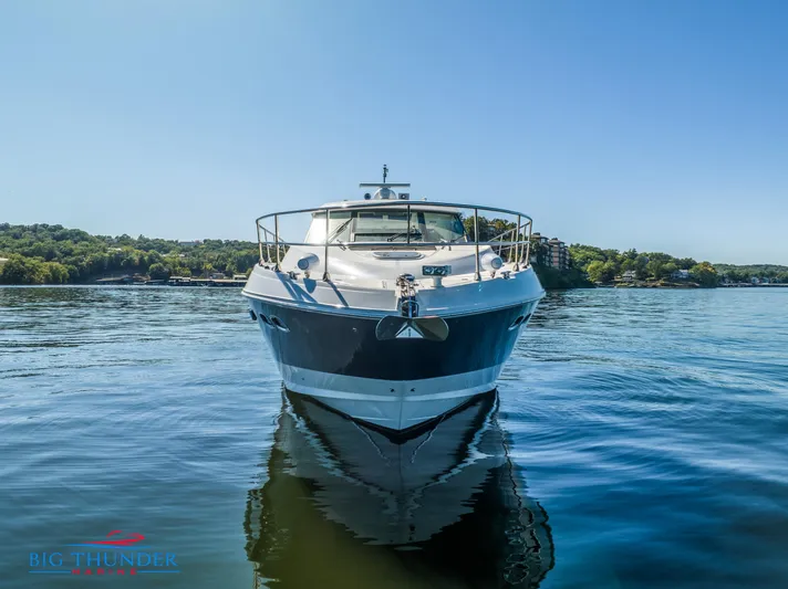  Yacht Photos Pics 2013 Sea Ray 540 Sundancer yacht on calm water, clear sky background.