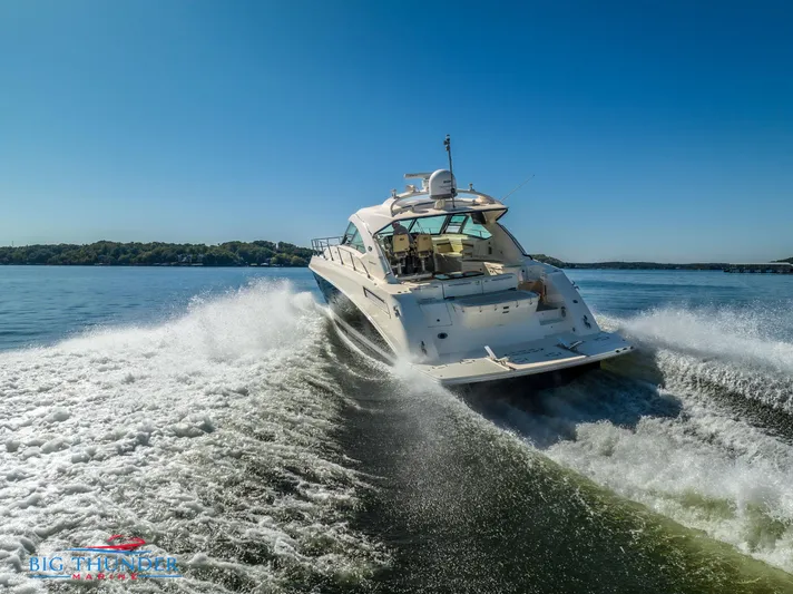  Yacht Photos Pics 2013 Sea Ray 540 Sundancer cruising on open water, creating a dynamic wake.