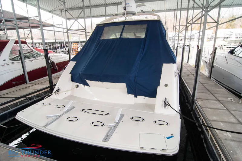  Yacht Photos Pics 2013 Sea Ray 540 Sundancer yacht docked with blue cover in marina.