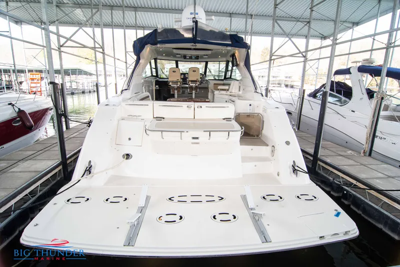  Yacht Photos Pics 2013 Sea Ray 540 Sundancer yacht docked in marina, rear view.