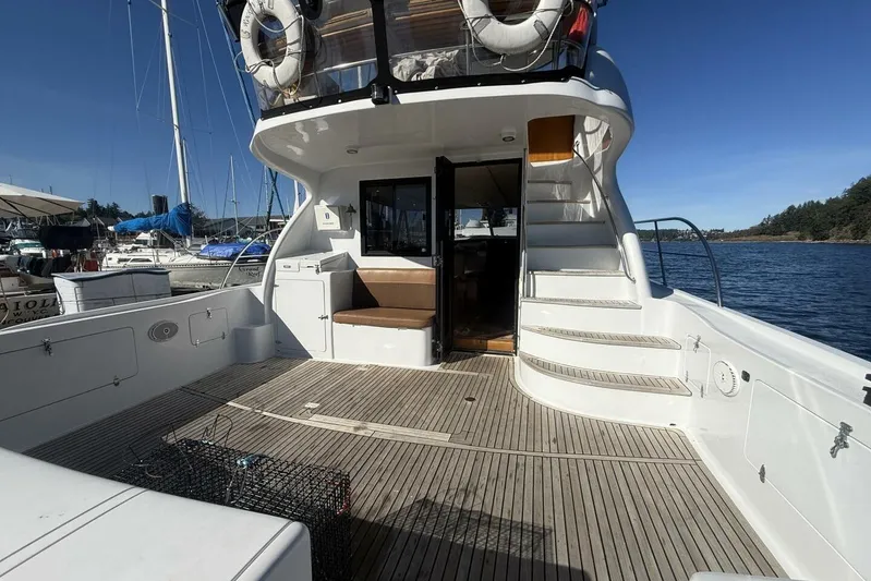  Yacht Photos Pics Royal Pacific 476 Sport Cruiser 2000, spacious deck, docked at marina, clear blue sky.