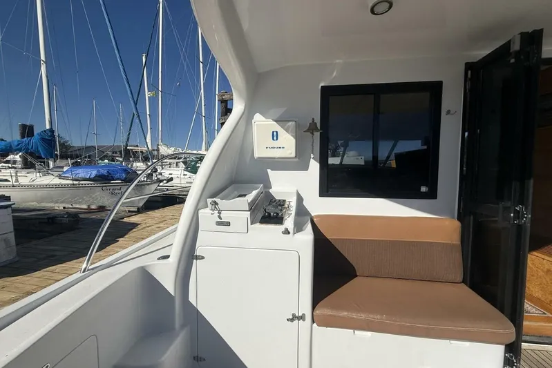  Yacht Photos Pics Royal Pacific 476 Sport Cruiser 2000, docked with seating area and marina view.