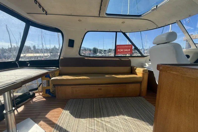  Yacht Photos Pics Interior of 2000 Royal Pacific 476 Sport Cruiser with seating and "For Sale" sign.