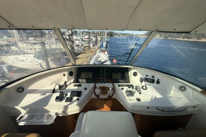  Yacht Photos Pics Cockpit view of 2000 Royal Pacific 476 Sport Cruiser, overlooking marina and waterway.