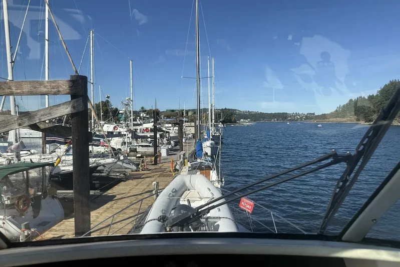  Yacht Photos Pics View from Royal Pacific 476 Sport Cruiser, 2000, docked at a marina with clear blue skies.
