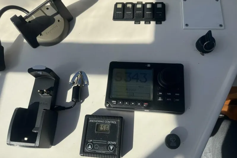  Yacht Photos Pics Control panel of a 2000 Royal Pacific 476 Sport Cruiser with navigation and anchoring controls.