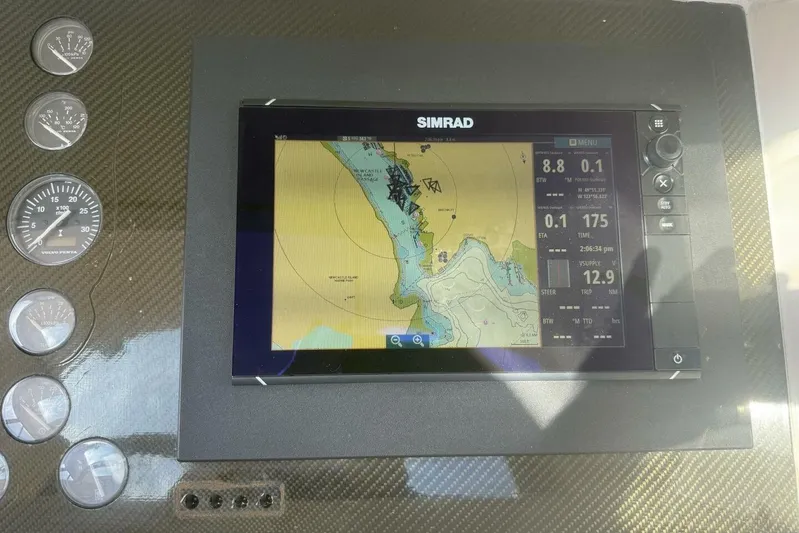  Yacht Photos Pics Dashboard of a 2000 Royal Pacific 476 Sport Cruiser with Simrad navigation display.