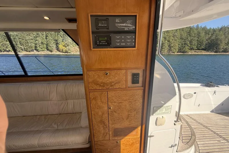  Yacht Photos Pics Interior of 2000 Royal Pacific 476 Sport Cruiser with wood paneling and lake view.