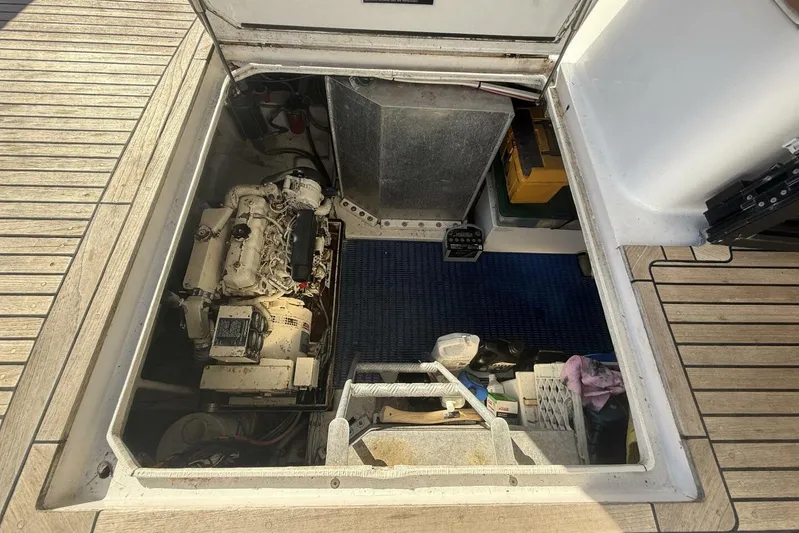  Yacht Photos Pics Engine compartment of a 2000 Royal Pacific 476 Sport Cruiser, showcasing mechanical components.