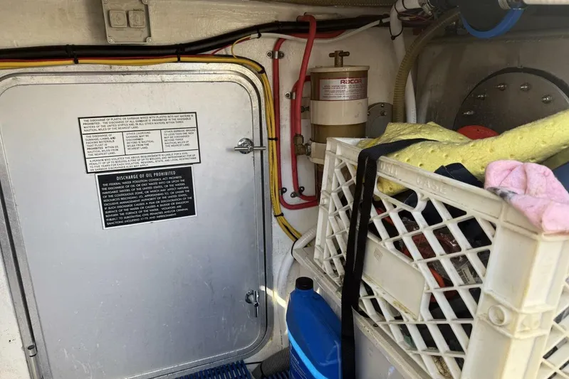  Yacht Photos Pics Engine room of 2000 Royal Pacific 476 Sport Cruiser with storage crate and oil filter.