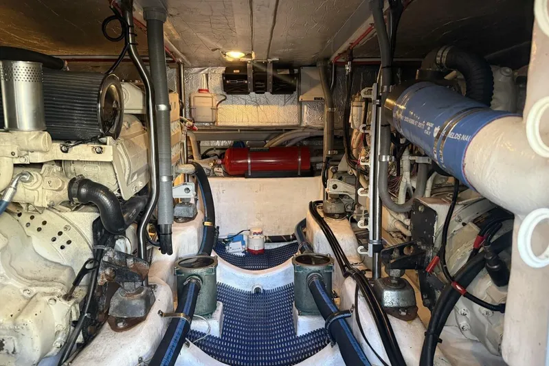  Yacht Photos Pics Engine room of a 2000 Royal Pacific 476 Sport Cruiser, showcasing mechanical components.