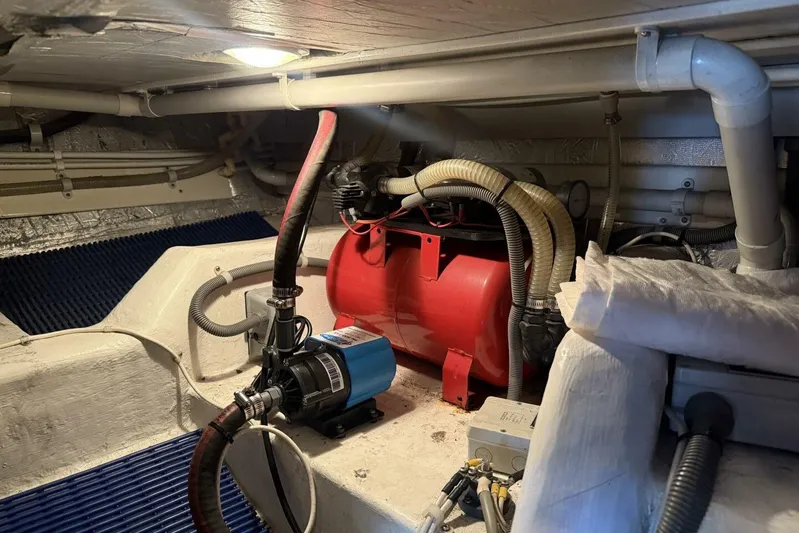  Yacht Photos Pics Engine room of 2000 Royal Pacific 476 Sport Cruiser with visible machinery and piping.