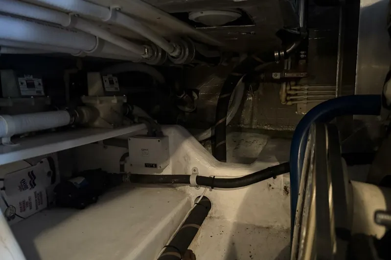  Yacht Photos Pics Engine room of 2000 Royal Pacific 476 Sport Cruiser with visible pipes and equipment.