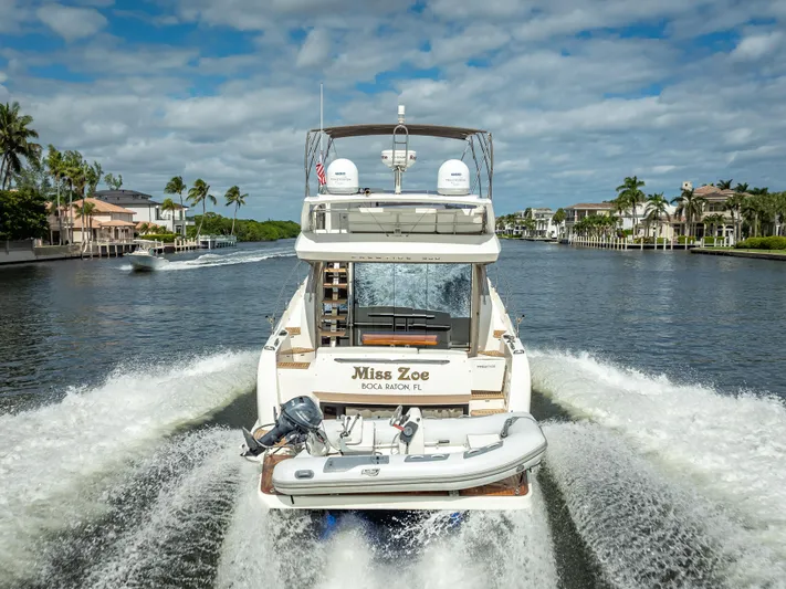 Miss Zoe Yacht Photos Pics Prestige 500 Fly 2014 yacht cruising on a scenic waterway.