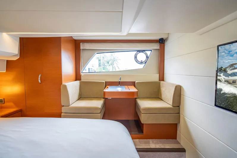 Miss Zoe Yacht Photos Pics Luxurious interior of 2014 Prestige 500 Fly yacht with cozy seating and window view.