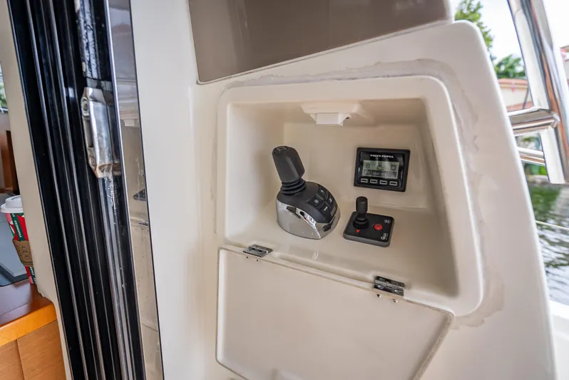 Miss Zoe Yacht Photos Pics Control panel of a 2014 Prestige 500 Fly yacht with joystick and display.