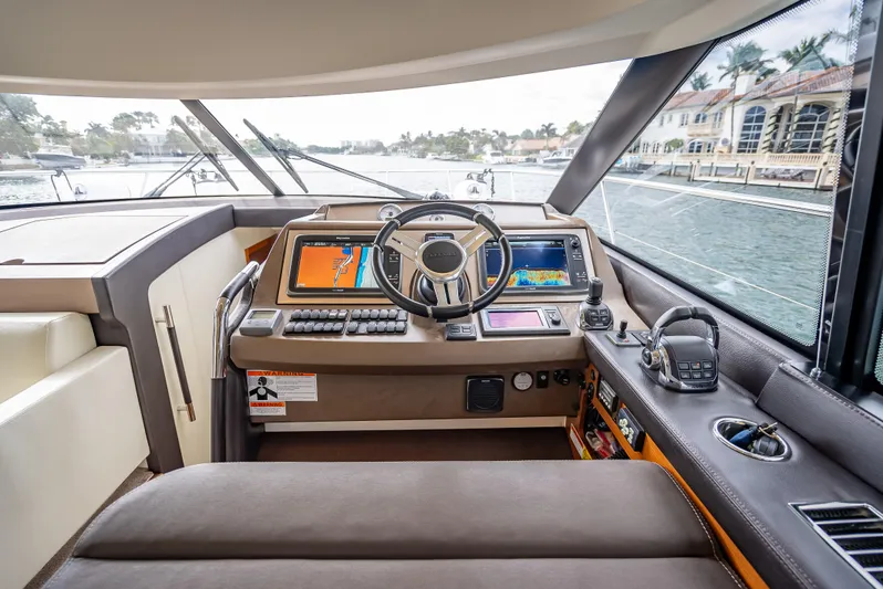 Miss Zoe Yacht Photos Pics Prestige 500 Fly 2014 yacht helm with navigation screens and controls.
