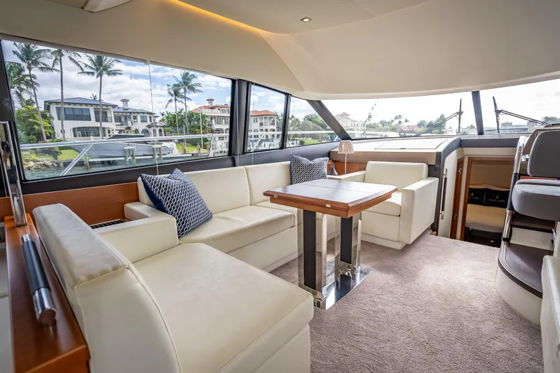 Miss Zoe Yacht Photos Pics Luxurious interior of 2014 Prestige 500 Fly yacht with elegant seating and scenic views.