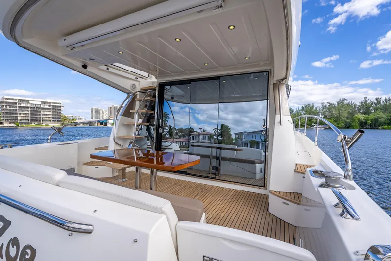 Miss Zoe Yacht Photos Pics 2014 Prestige 500 Fly yacht with spacious deck and scenic waterfront view.