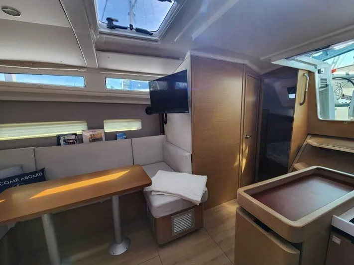 Fred's Dream Yacht Photos Pics Interior of 2020 Jeanneau Sun Odyssey 410 yacht with modern seating and natural light.