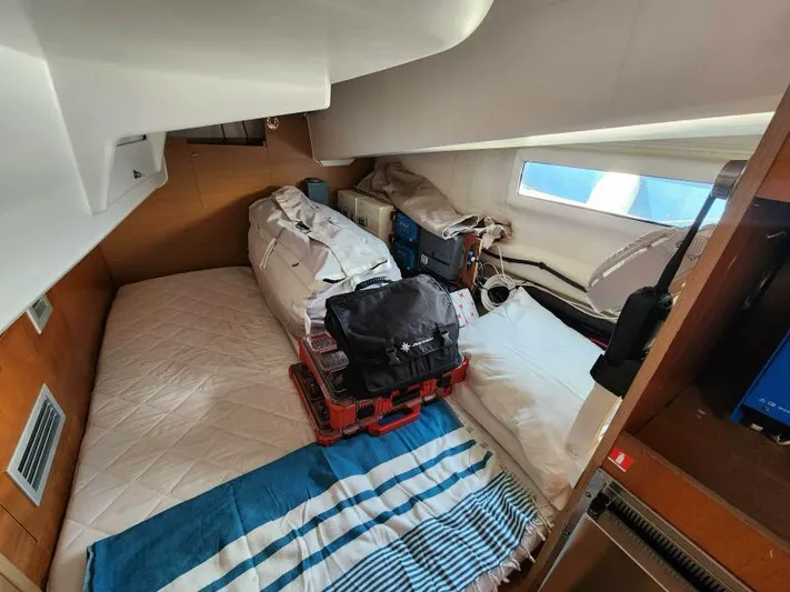 Fred's Dream Yacht Photos Pics Cabin interior of 2020 Jeanneau Sun Odyssey 410 sailboat with storage and bedding.