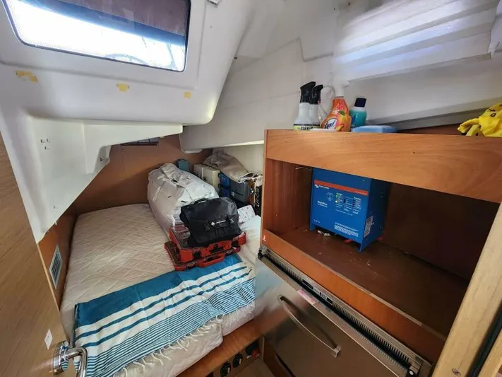 Fred's Dream Yacht Photos Pics Cozy cabin interior of 2020 Jeanneau Sun Odyssey 410 sailboat with bed and storage.