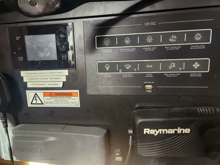 Fred's Dream Yacht Photos Pics Control panel of 2020 Jeanneau Sun Odyssey 410 with Raymarine and Fusion systems.