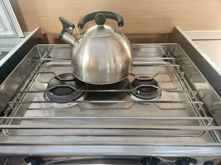 Fred's Dream Yacht Photos Pics Stainless steel kettle on stove in Jeanneau Sun Odyssey 410 yacht kitchen, 2020 model.
