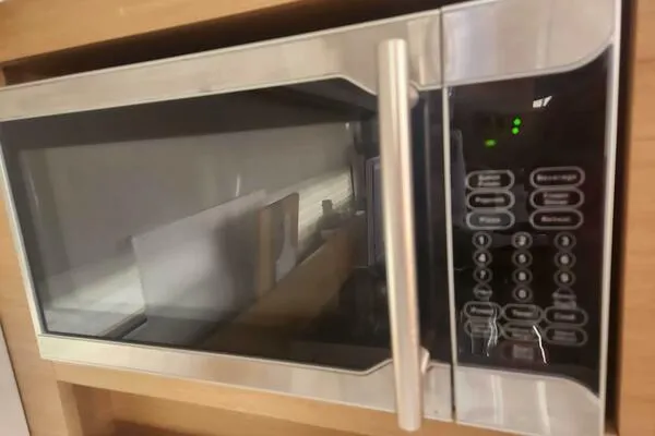 Fred's Dream Yacht Photos Pics Microwave oven inside a 2020 Jeanneau Sun Odyssey 410 yacht kitchen.