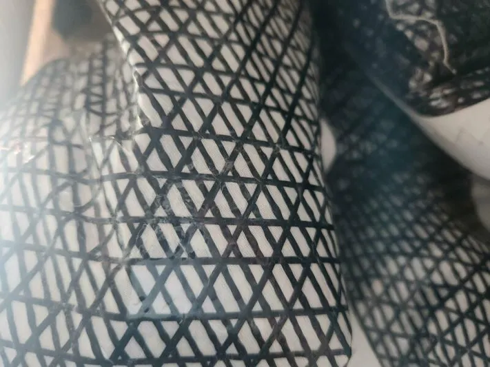 Fred's Dream Yacht Photos Pics Close-up of Jeanneau Sun Odyssey 410 sail with black crisscross pattern, 2020 model.