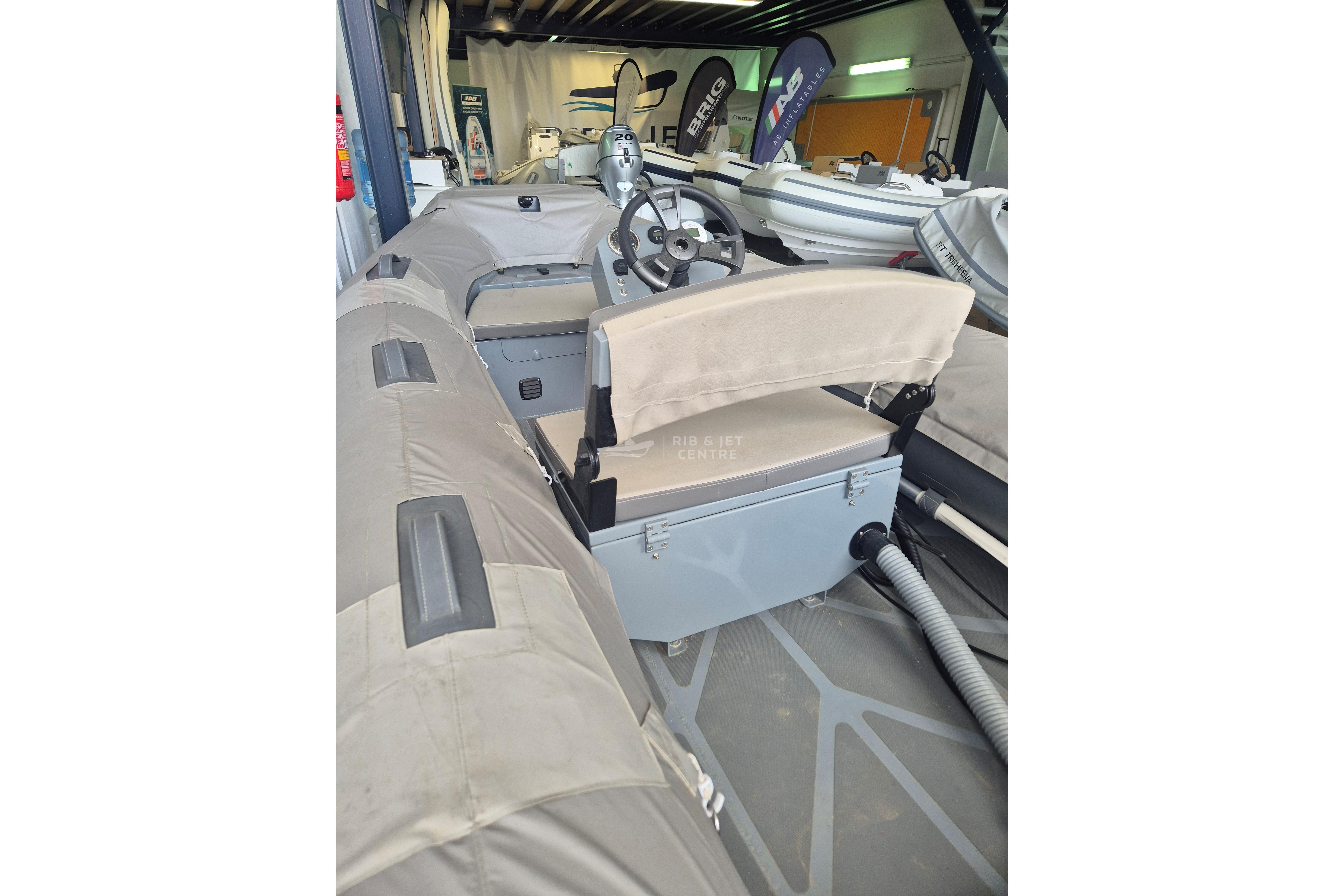 2024 Zur Mini Rib 13 inflatable boat interior with steering wheel and seating.