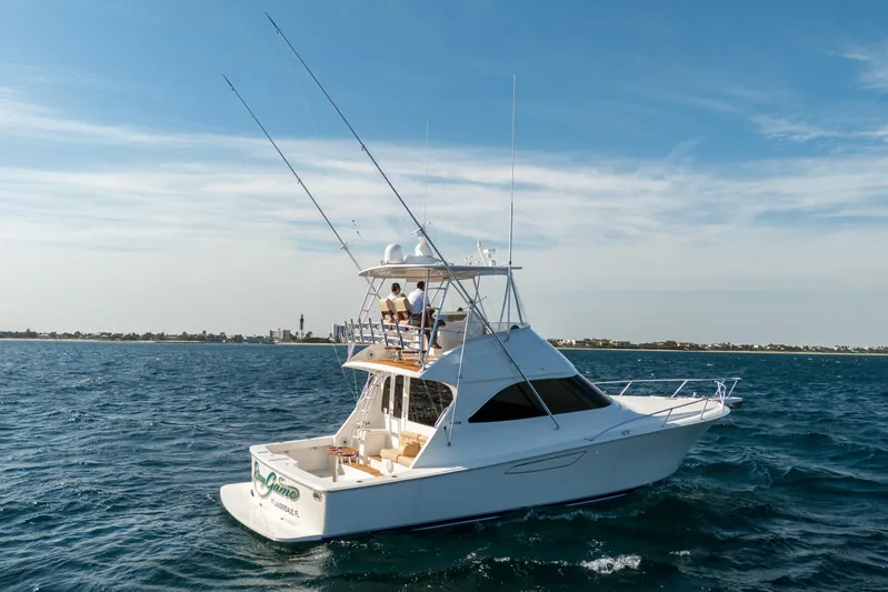 Ring Game Yacht Photos Pics 2008 Viking 42 Convertible yacht cruising on open water under clear skies.