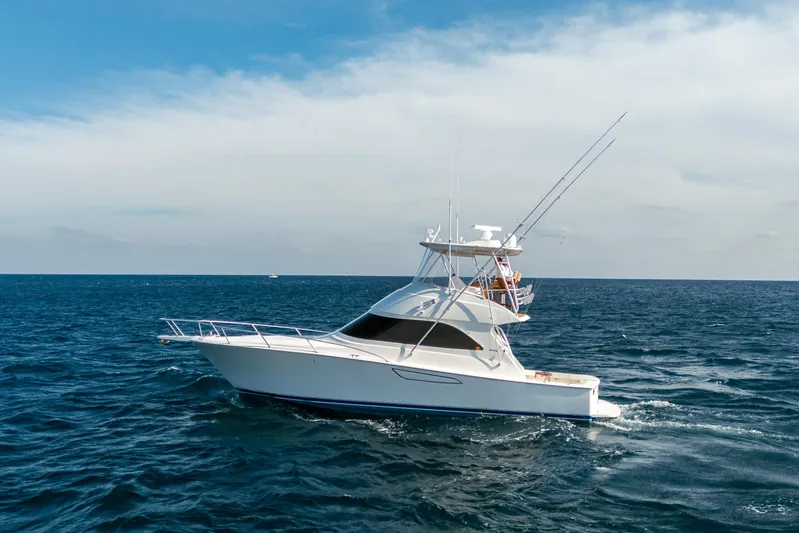 Ring Game Yacht Photos Pics 2008 Viking 42 Convertible yacht cruising on open ocean waters.