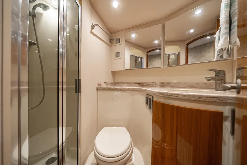 Ring Game Yacht Photos Pics Luxurious bathroom in 2008 Viking 42 Convertible yacht with shower and modern fixtures.