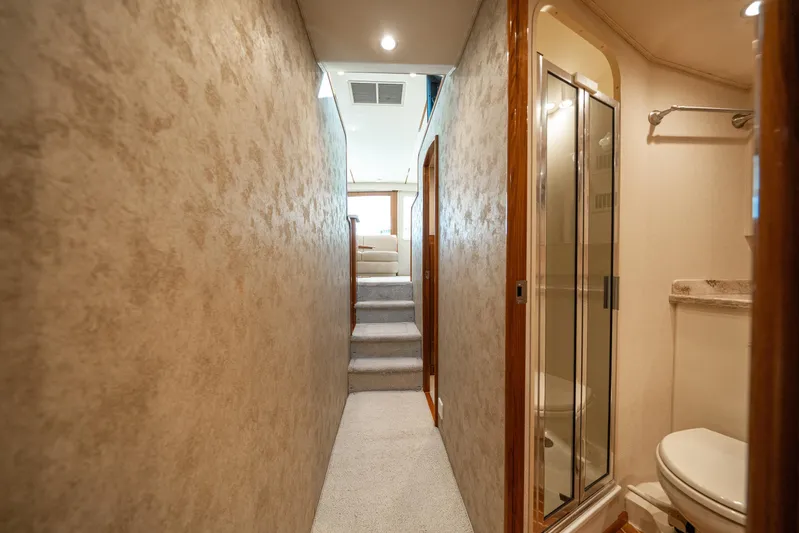 Ring Game Yacht Photos Pics Interior hallway of 2008 Viking 42 Convertible yacht with bathroom and stairs.