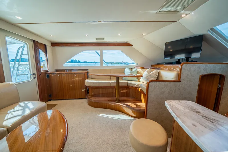 Ring Game Yacht Photos Pics Luxurious interior of 2008 Viking 42 Convertible yacht with elegant seating and scenic views.