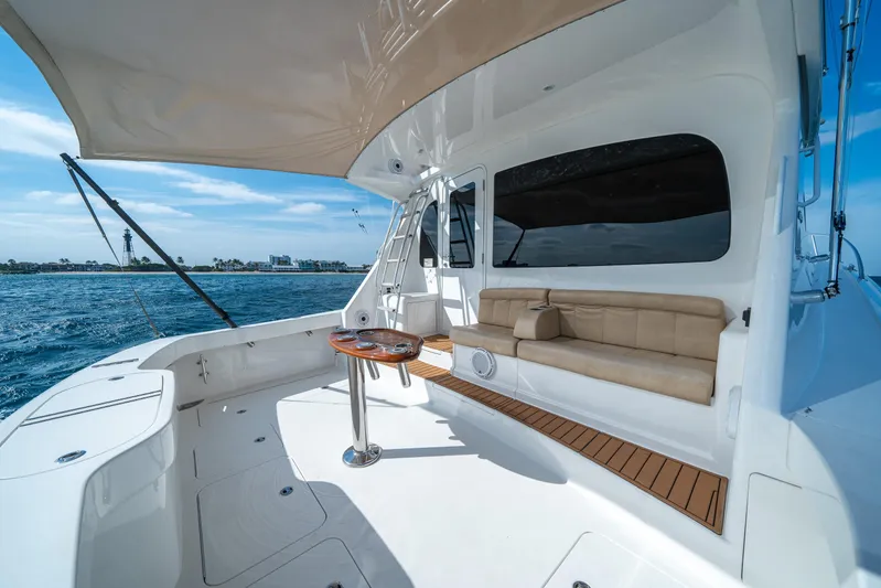 Ring Game Yacht Photos Pics 2008 Viking 42 Convertible yacht deck with seating and ocean view.