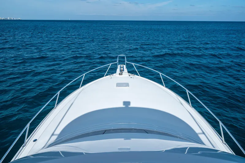 Ring Game Yacht Photos Pics Bow view of 2008 Viking 42 Convertible yacht on open sea.