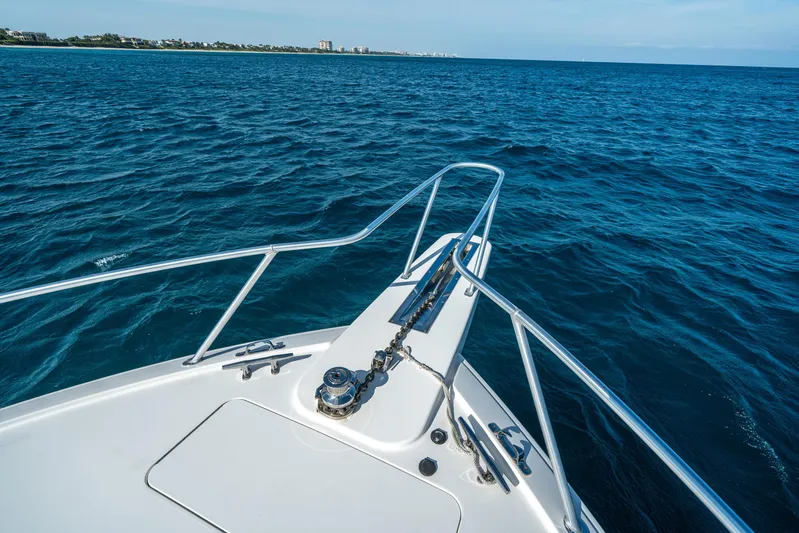 Ring Game Yacht Photos Pics Bow of 2008 Viking 42 Convertible yacht cruising on open blue sea.