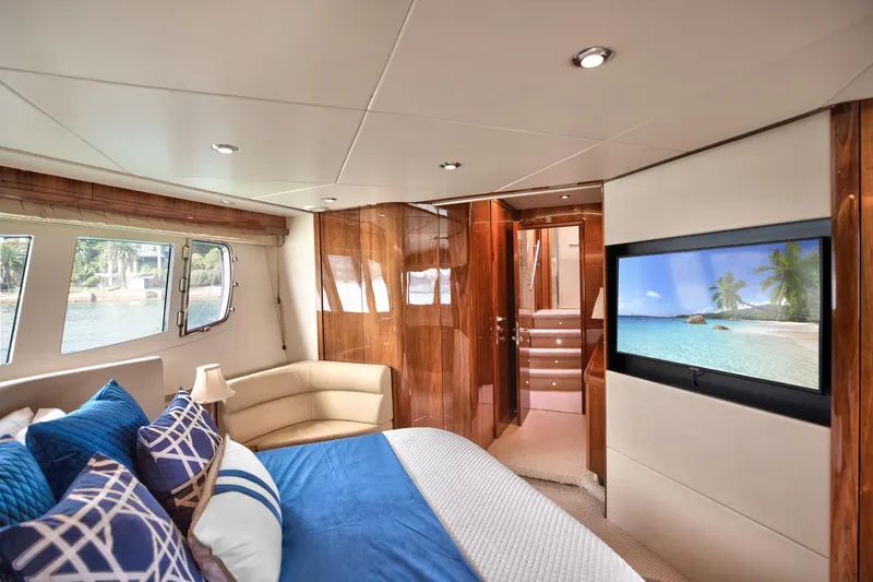 Azzurro Yacht Photos Pics Luxurious interior of 2009 Sunseeker Manhattan 70 yacht with elegant bedroom and scenic view.