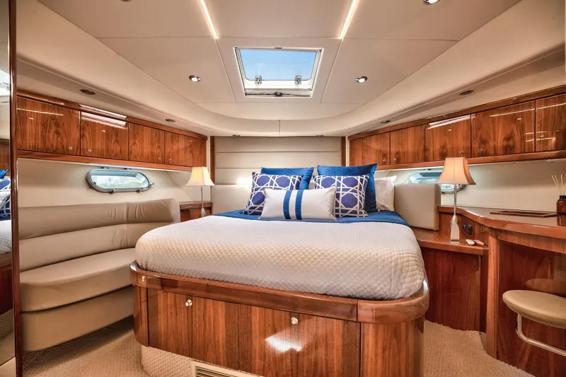 Azzurro Yacht Photos Pics Luxurious bedroom interior of 2009 Sunseeker Manhattan 70 yacht with elegant wood finish.