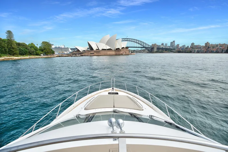 Azzurro Yacht Photos Pics Sunseeker Manhattan 70 yacht approaching Sydney Opera House and Harbour Bridge, 2009 model.