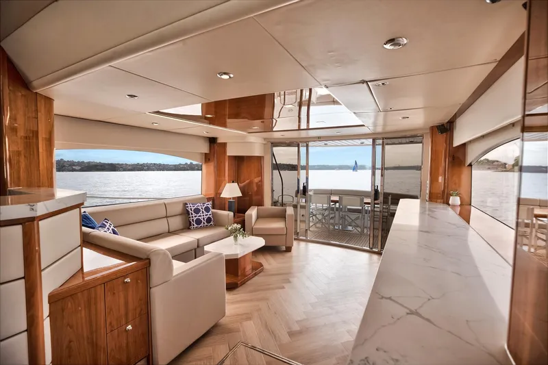 Azzurro Yacht Photos Pics Luxurious interior of 2009 Sunseeker Manhattan 70 yacht with elegant seating and panoramic views.