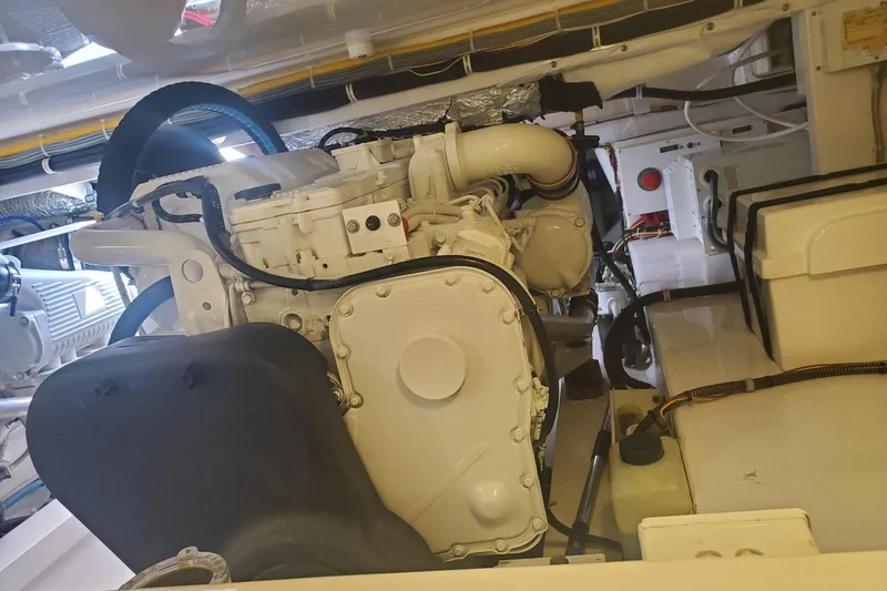 Ring Game Yacht Photos Pics Engine room of a 2015 Viking 42 Convertible yacht, showcasing mechanical components.