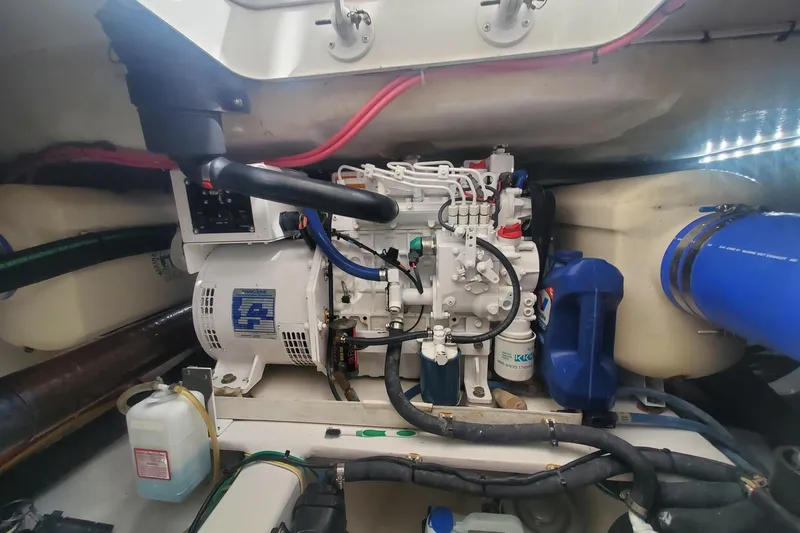 Ring Game Yacht Photos Pics Engine room of 2015 Viking 42 Convertible boat, showcasing mechanical components and wiring.
