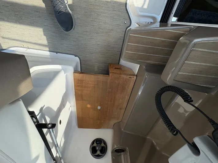 Wining Down Yacht Photos Pics 2016 Regal 35 Sport Coupe interior with wooden panel and speaker detail.