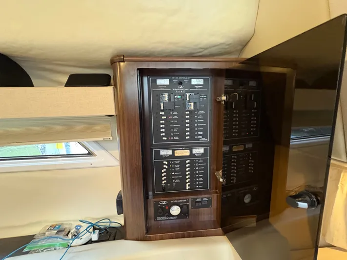 Wining Down Yacht Photos Pics Electrical panel inside 2016 Regal 35 Sport Coupe boat cabin.