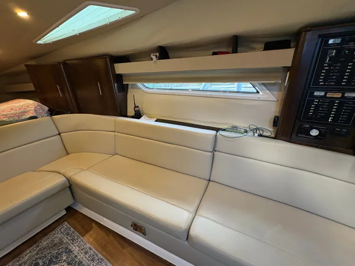 Wining Down Yacht Photos Pics Interior of 2016 Regal 35 Sport Coupe with beige seating and control panel.