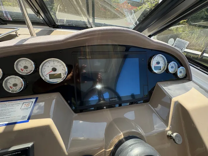 Wining Down Yacht Photos Pics Dashboard of a 2016 Regal 35 Sport Coupe with gauges and Garmin GPS.